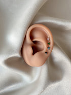 Piercing Delta colorful titanio